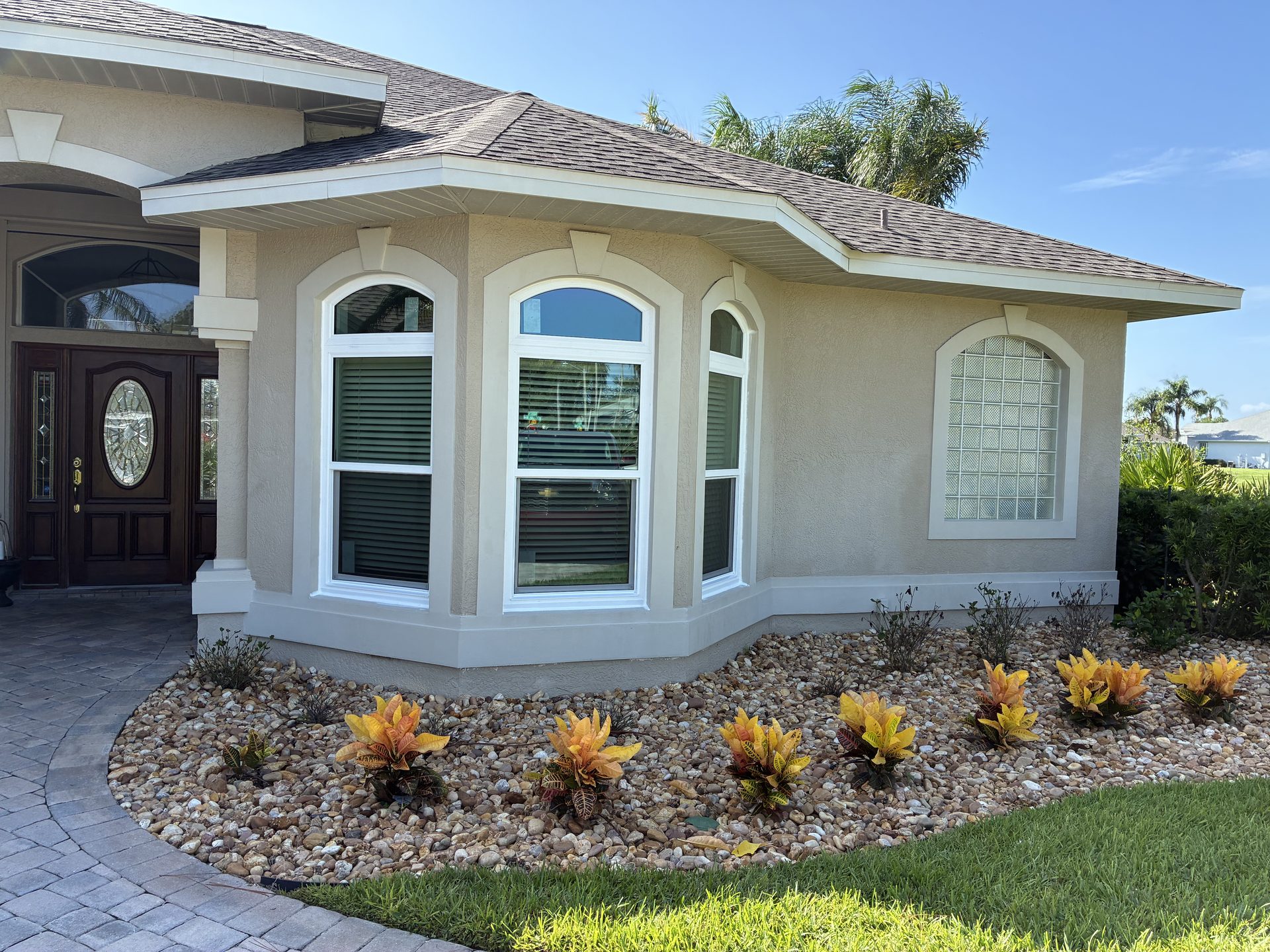 Home with new impact bay windows installed by AGP